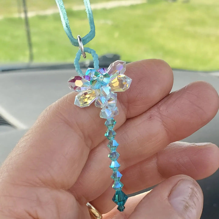 Beaded 3-D Rearview Mirror Colored Crystal Dragonfly Charm held in hand with colorful crystals and bead details.