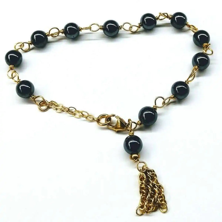Adjustable 14 KT Gold Filled Hematite Chain Tassel Bracelet showcasing gold chain and shiny hematite beads.
