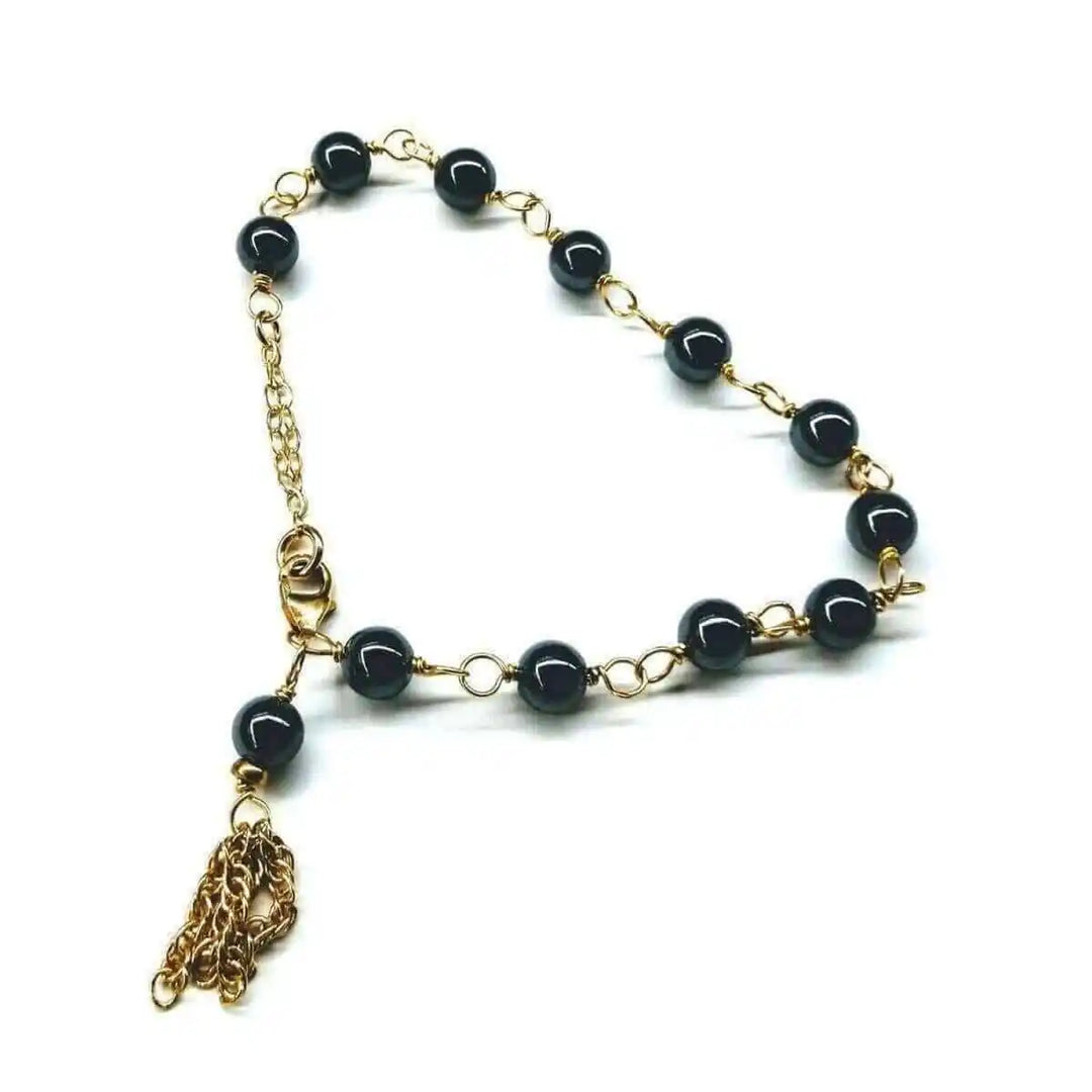 Adjustable 14 KT Gold Filled Hematite Chain Tassel Bracelet featuring gold filled chain and hematite beads.