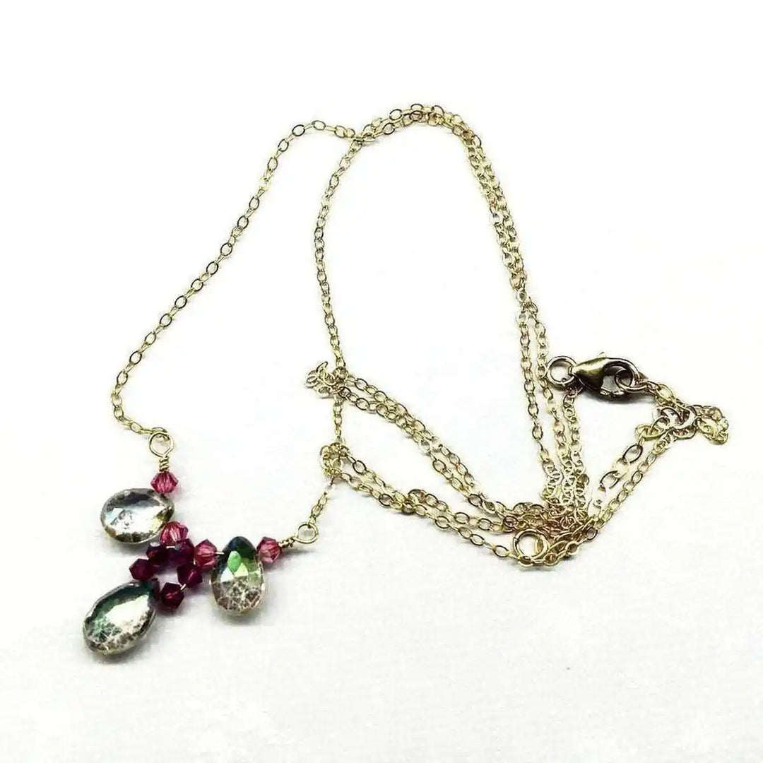 Adjustable Gold Filled Wire Wrapped Gemstone Necklace featuring mystic rainbow quartz and fuchsia Swarovski crystals.