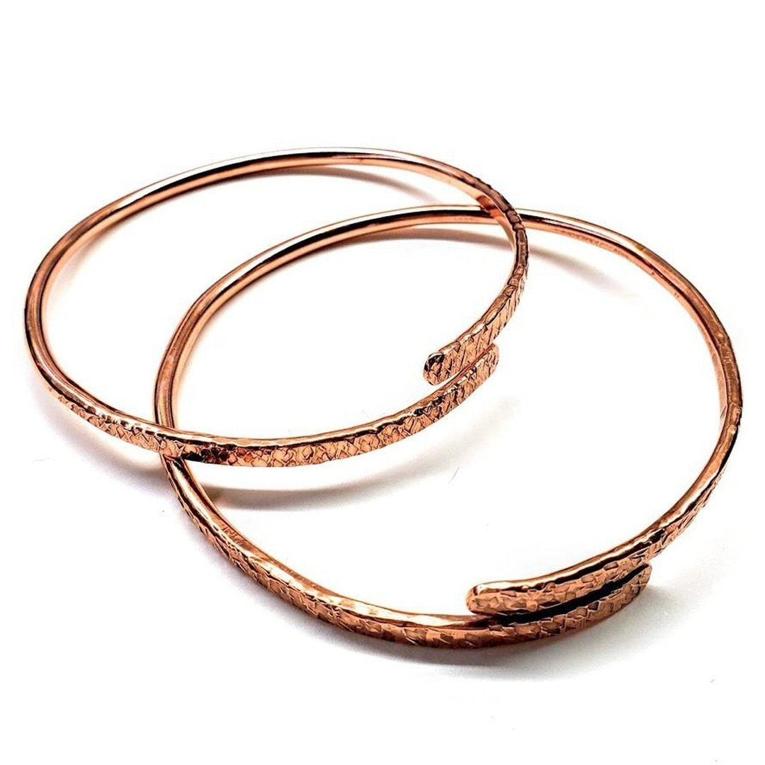 Unisex 8 Gauge Adjustable Hammered Copper Overlap Bangle showcasing bold metalsmith artistry and distinctive design.