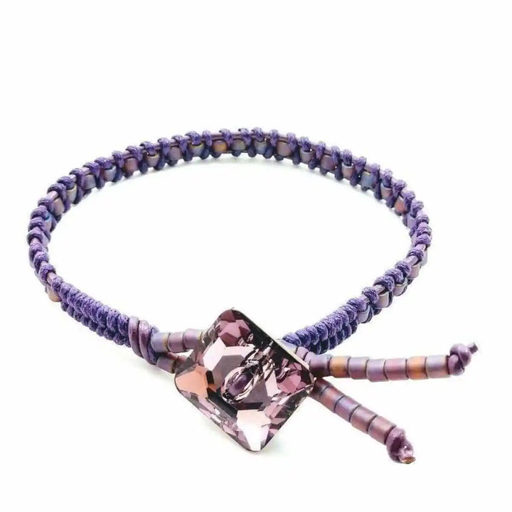 Amethyst Braided Leather Swarovski Crystal Button Bracelet featuring a unique braided design and sparkling crystal.