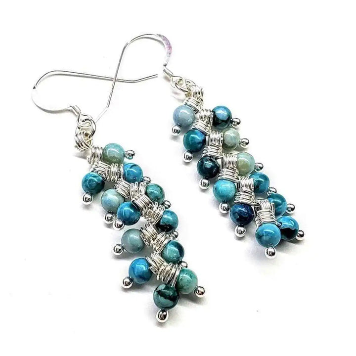 Seen On Jane The Virgin Silver Turquoise Wire Coil Earrings featuring vibrant turquoise beads and elegant silver wire design.