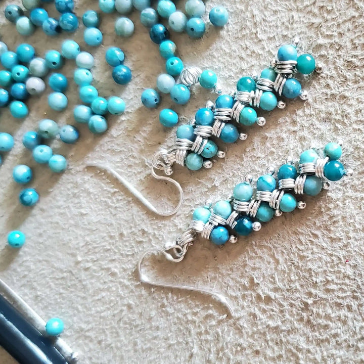 Seen On Jane The Virgin Silver Turquoise Wire Coil Earrings with turquoise beads and silver wire.