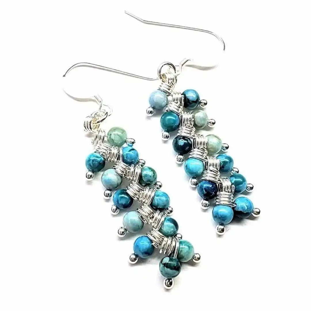 Seen On Jane The Virgin Silver Turquoise Wire Coil Earrings featuring blue and turquoise beads on silver wire.