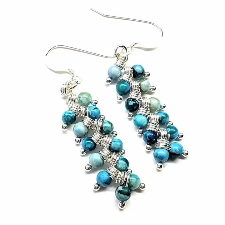 Seen On Jane The Virgin Silver Turquoise Wire Coil Earrings featuring blue and turquoise beads on silver wire.