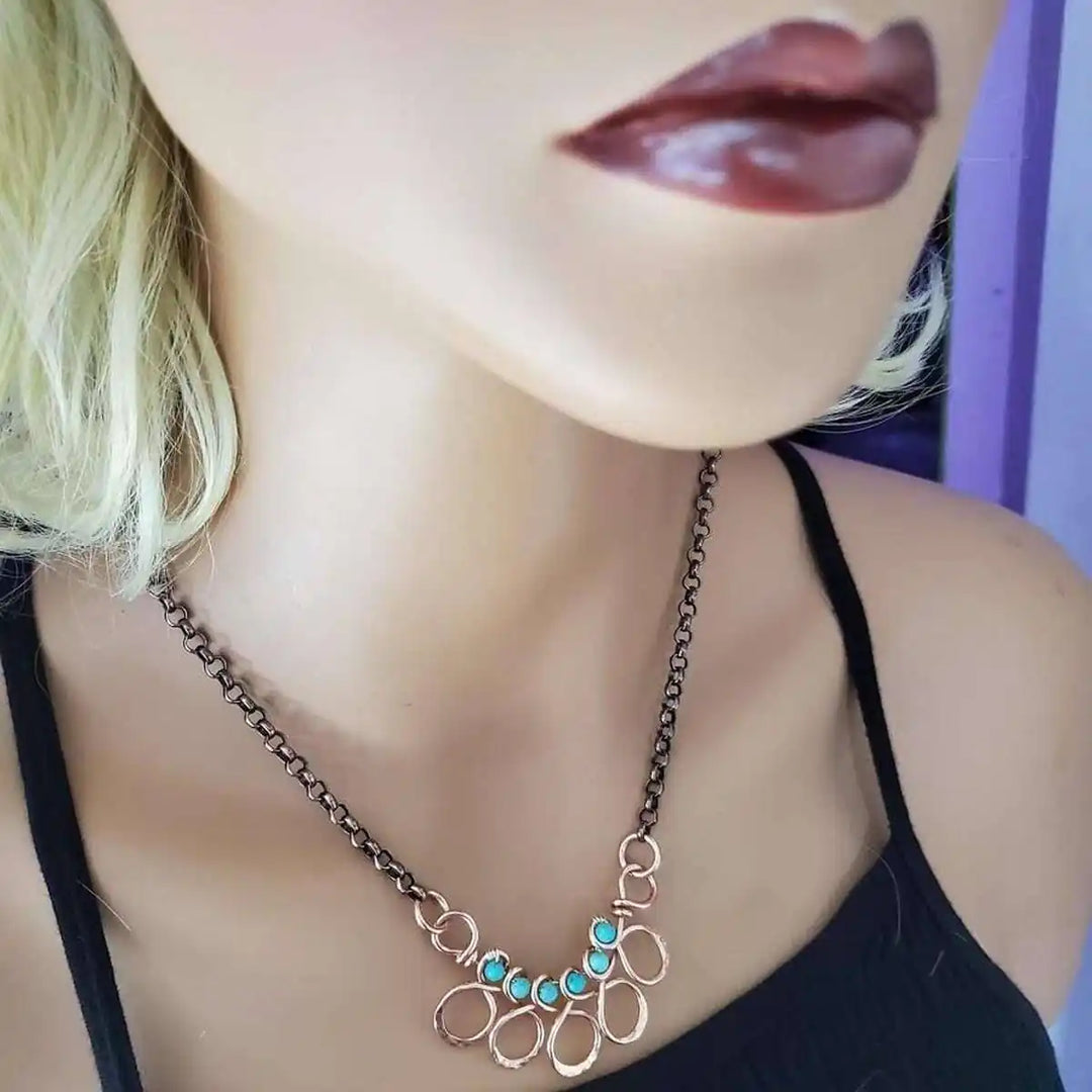 Seen on Ashley Liao Copper Turquoise Wire Wrapped Necklace displayed on a mannequin&