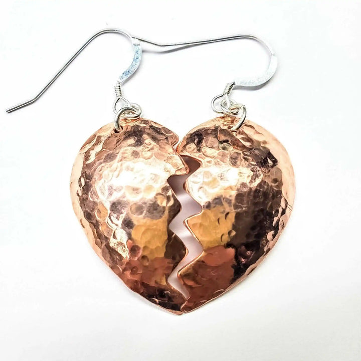 Handmade Sculpted Copper Broken Heart Earrings with a hammered finish, showcasing a unique broken heart design.