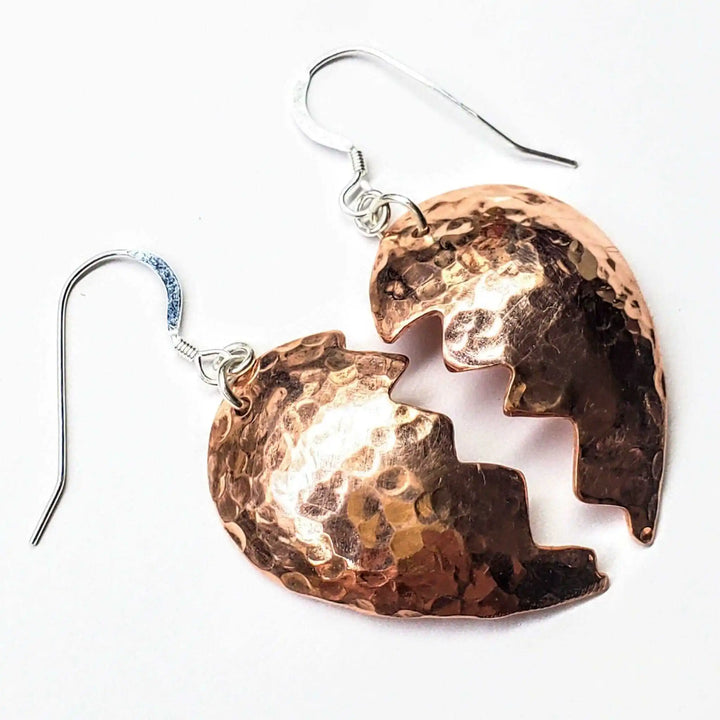 Handmade Sculpted Copper Broken Heart Earrings showcasing stunning copper craftsmanship and emotional design.