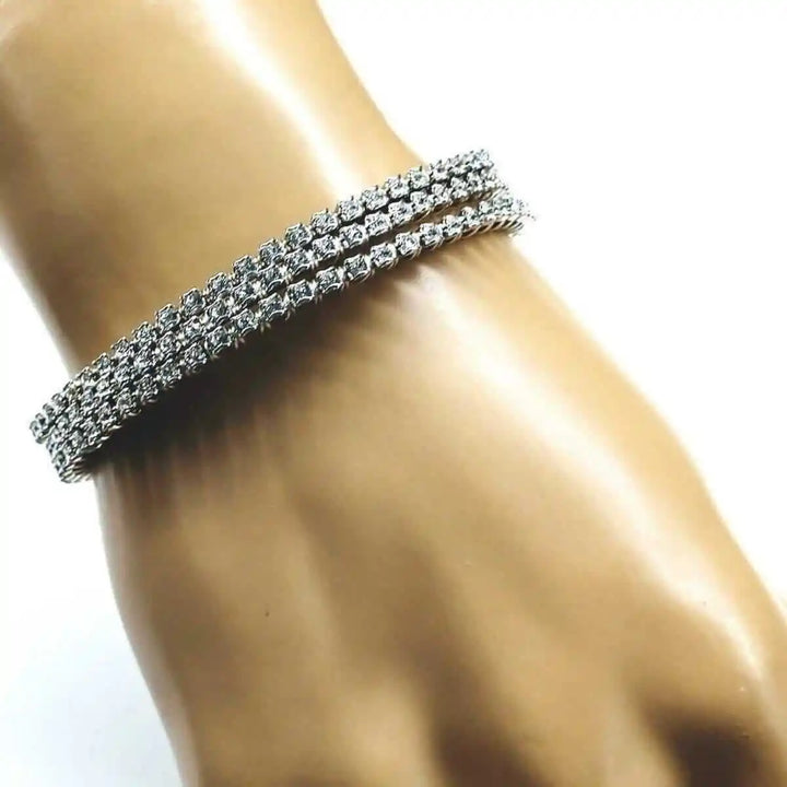 Catch-Free Crystal Rhinestone Tennis Bracelet Bangle worn on a hand showcasing its sparkling design and elegant style.