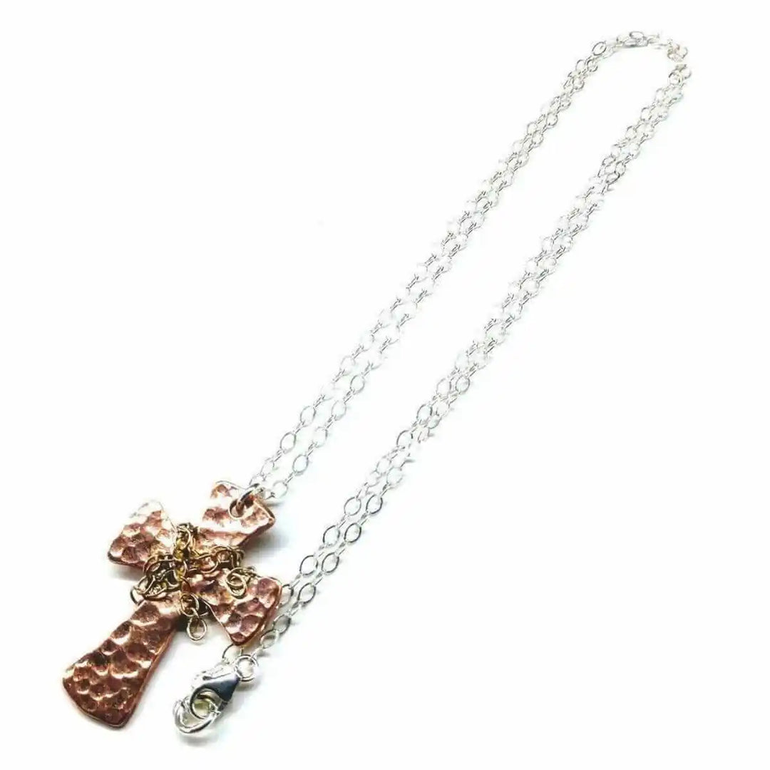 Chained Hammered Copper Cross Necklace For Him Or Her with a silver chain and hand-hammered copper cross pendant.