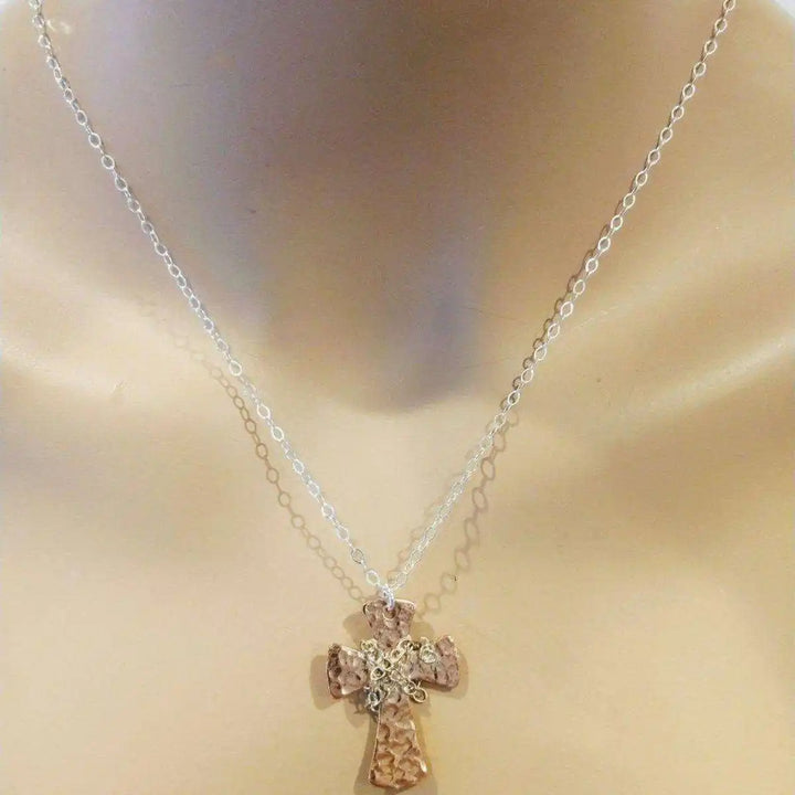Chained Hammered Copper Cross Necklace For Him Or Her displayed on a mannequin showcasing its artisan craftsmanship.