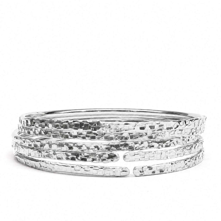 10 Gauge 925 Silver Hammer Textured Bangle showcasing a hammered design, perfect for layering and everyday wear.