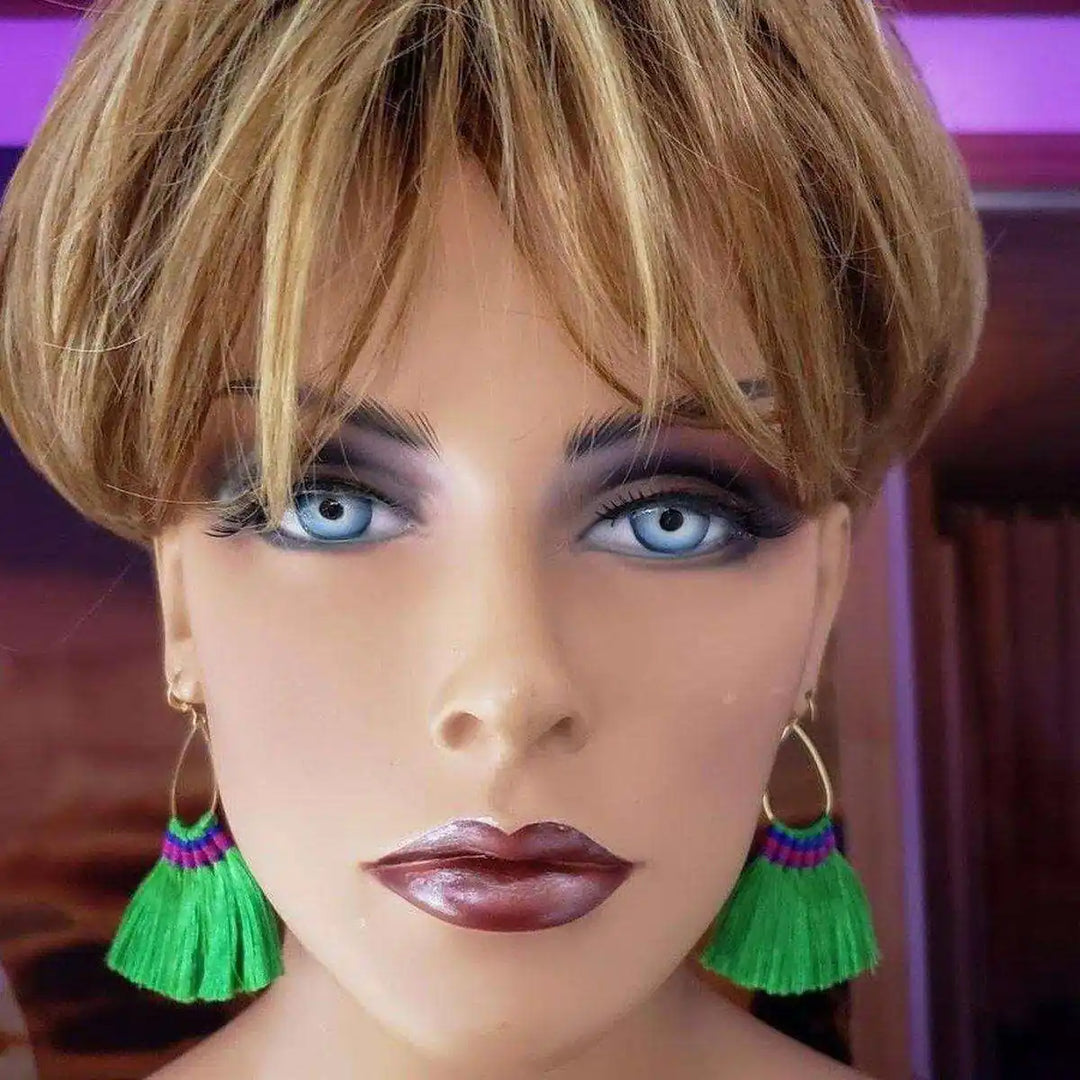 Handmade Hawaii Hula Skirt Rayon Silk Tassel Hoop Earrings displayed on a mannequin model with green tassels.