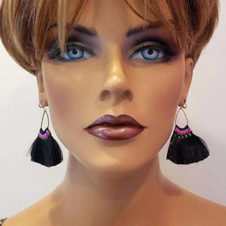 Handmade Hawaii Hula Skirt Rayon Silk Tassel Hoop Earrings displayed on a mannequin, showcasing vibrant tassel design.