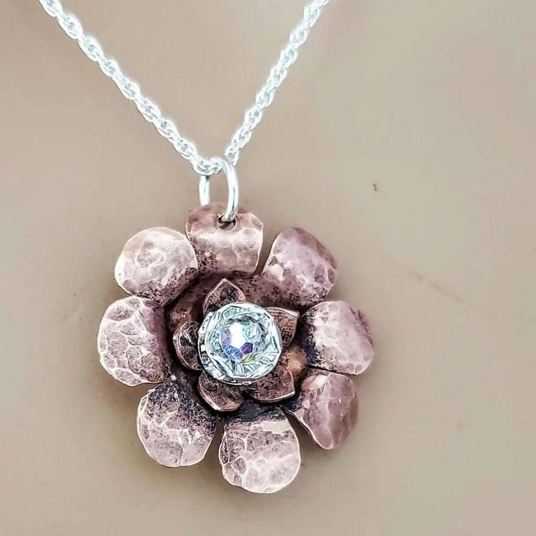 Copper Crystal Flower Blossom Fidget Spinner Necklace featuring a handmade hammered metal flower design.