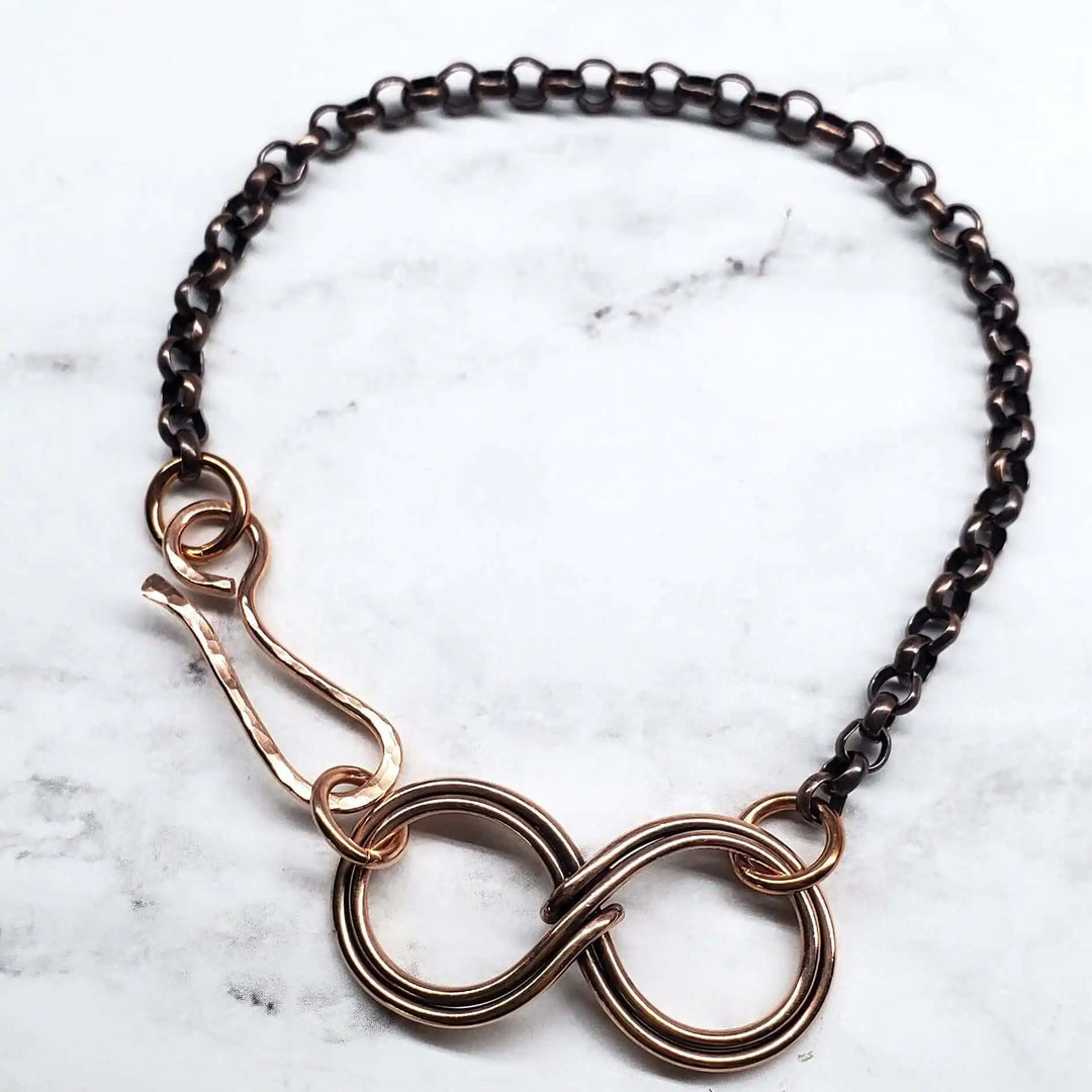 Wire Sculpted Copper Double Infinity Chain Bracelet showcasing intricate design and warm copper tones.