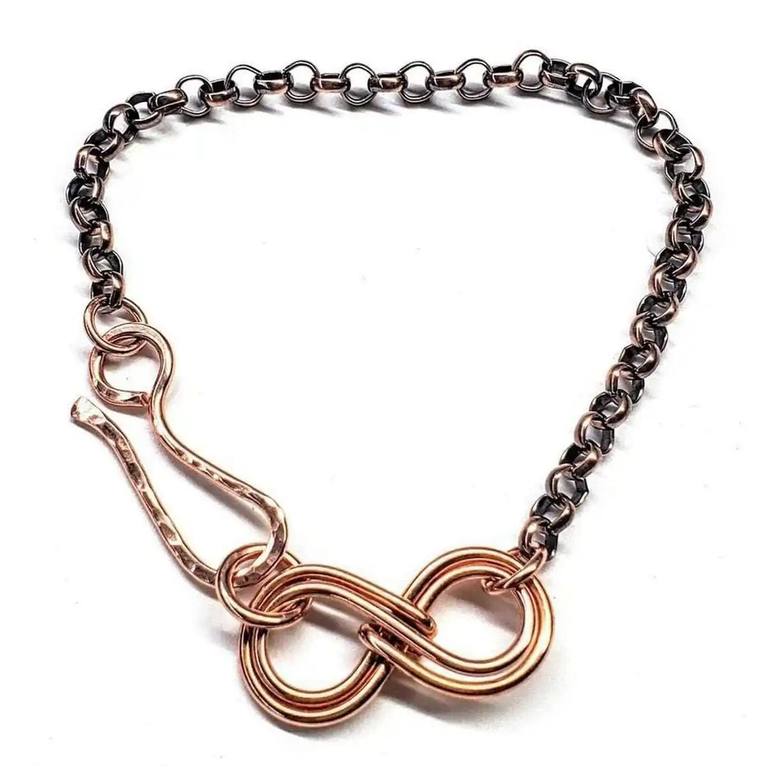 Wire Sculpted Copper Double Infinity Chain Bracelet showcasing an intricate double infinity symbol and artisan design.