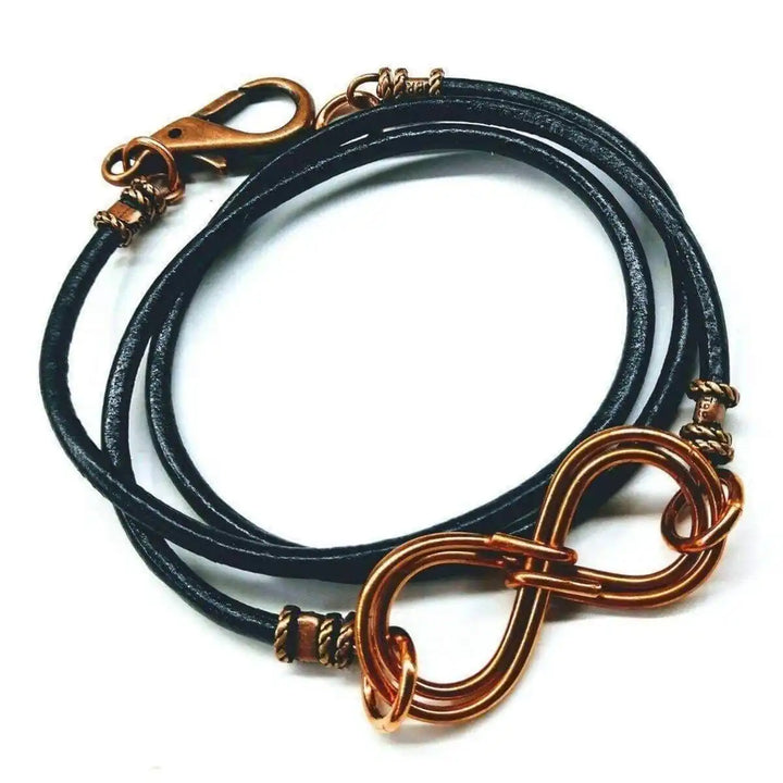 Copper Double Infinity Gender Neutral Leather Wrap Bracelet featuring hand-formed copper infinity symbols on black leather.