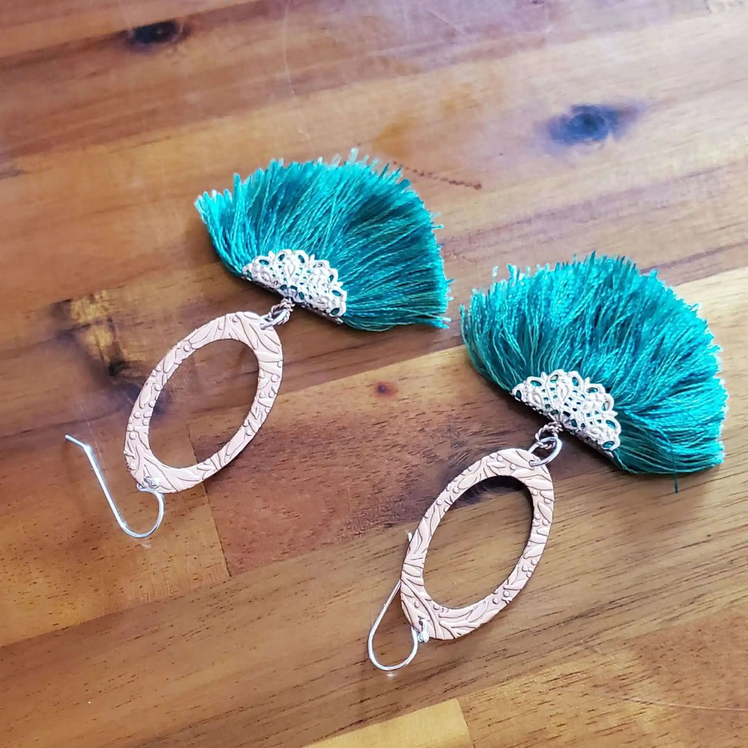 Rose Gold Filigree Silk Tassel Earrings Copper Embossed with vibrant teal silk tassels and intricate copper detailing.