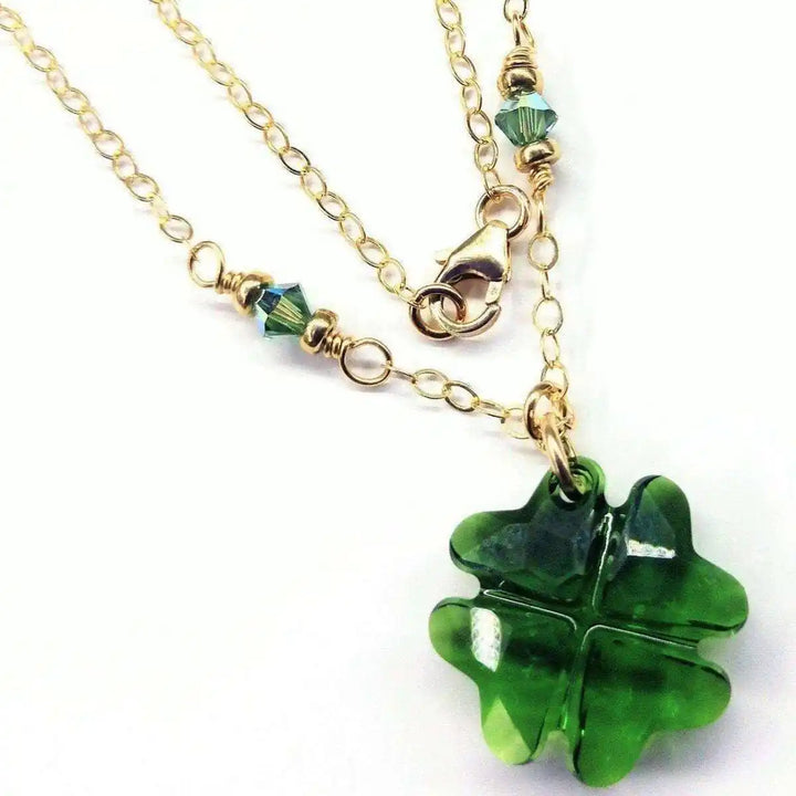 Dark Green Sparkly Crystal Lucky Clover Necklace featuring a green clover pendant and gold chain.