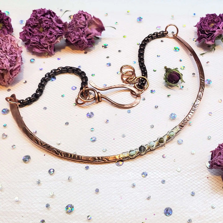 Ergonomic Copper Sculpted Embossed Wire Gemstone Choker with Peruvian Opal accents on a sparkling background