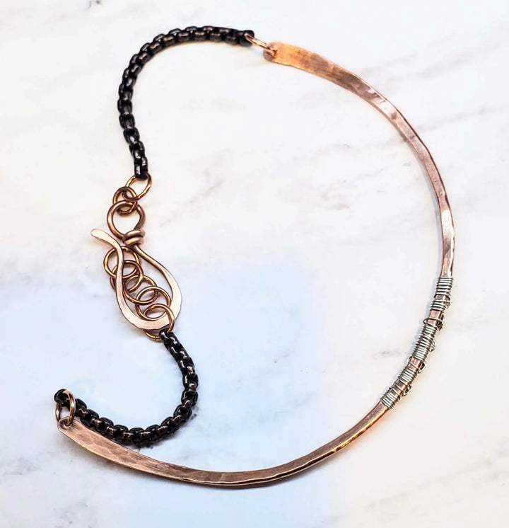 Ergonomic Copper Sculpted Embossed Wire Gemstone Choker with unique design and natural elements, showcasing artisanal craftsmanship.