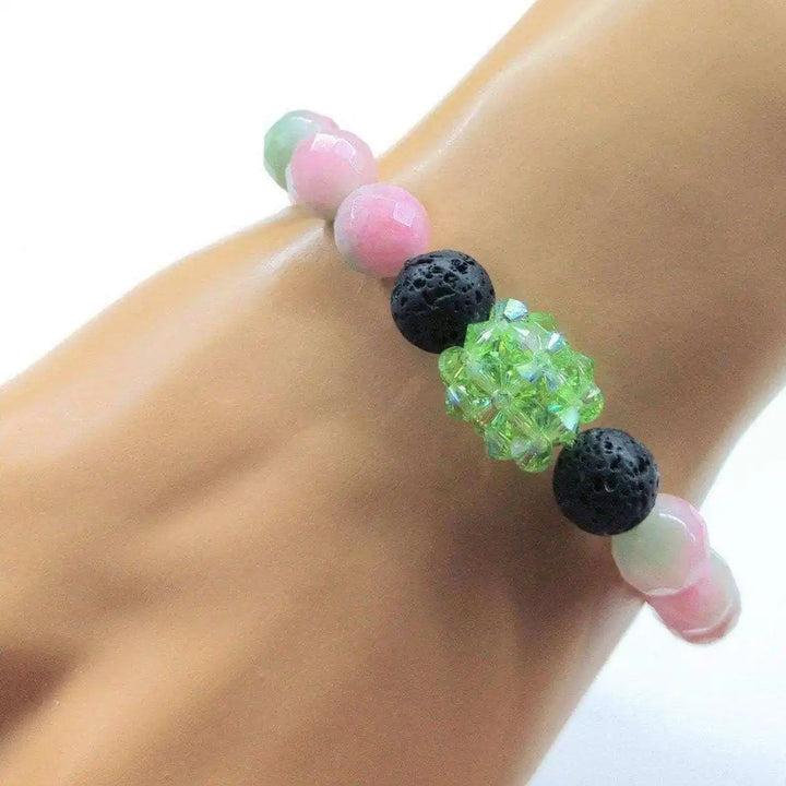 Gem Packed Watermelon Jade Crystal Lava Rock Bracelet featuring pink jade and black lava rock beads.