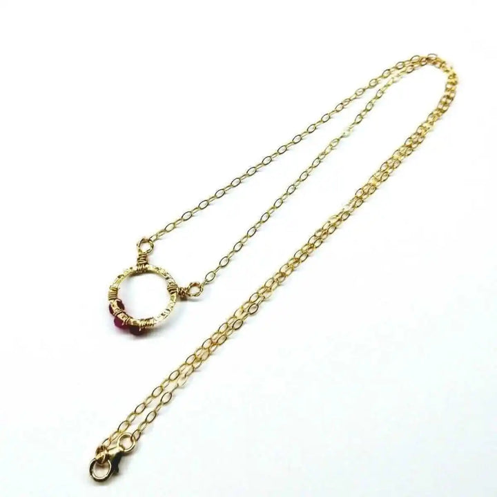 Gold Filled Pink Chalcedony Open Circle Necklace showing gold filled chain and circular pendant with pink chalcedony.