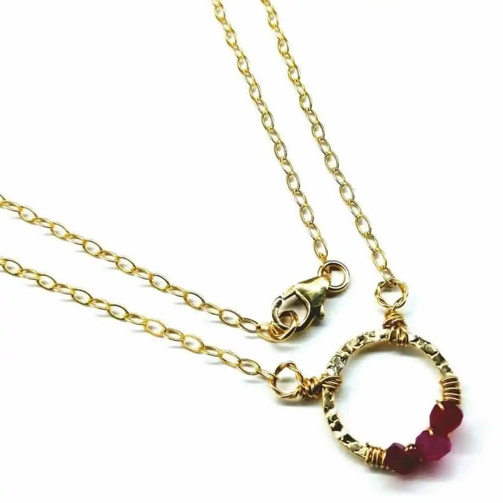 Gold Filled Pink Chalcedony Open Circle Necklace featuring a hand-hammered gold pendant and vibrant pink gemstones.