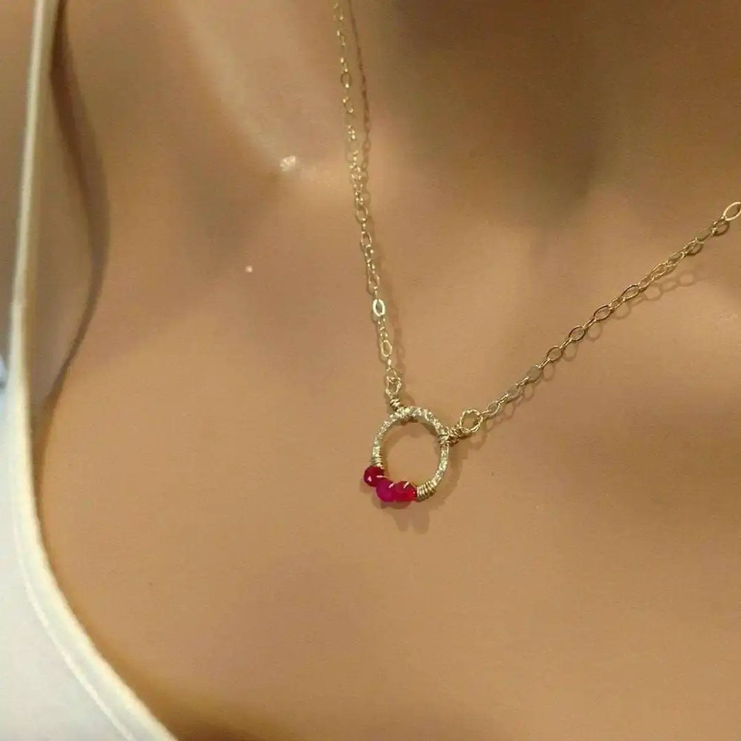 Gold Filled Pink Chalcedony Open Circle Necklace featuring a hand-hammered gold pendant on a mannequin.
