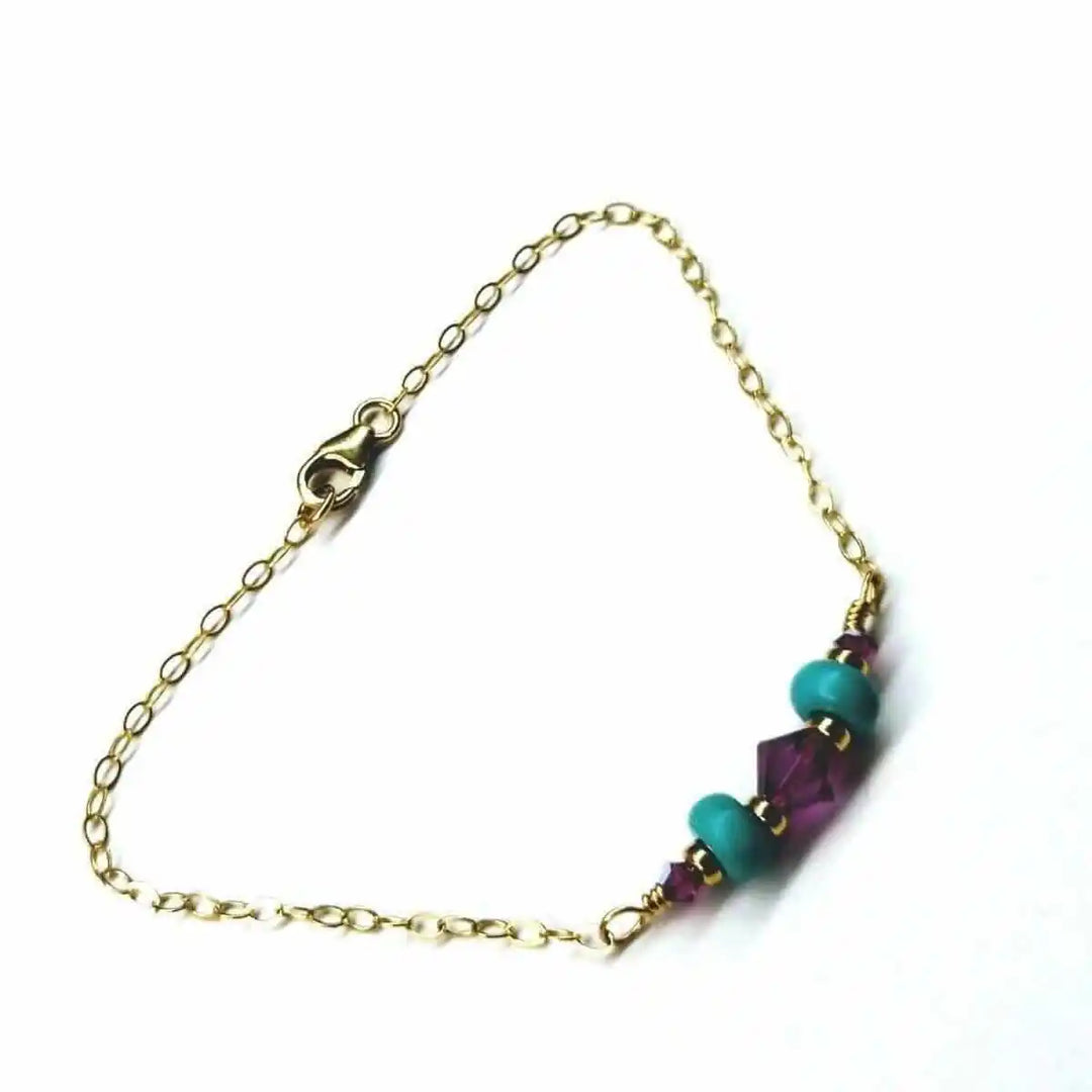 Handmade Gold Filled Pink Turquoise Gemstone Bracelet featuring pink fuchsia Swarovski crystals and turquoise beads.