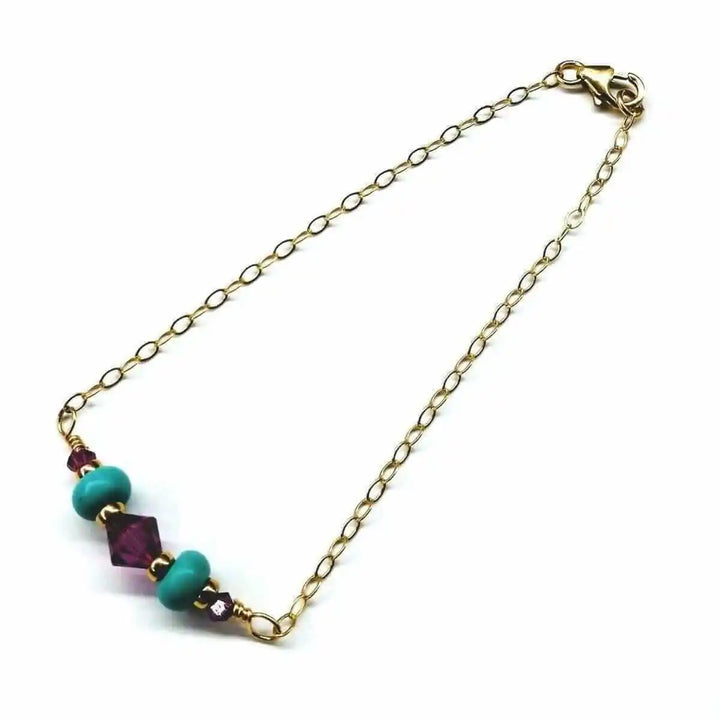 Handmade Gold Filled Pink Turquoise Gemstone Bracelet featuring pink Swarovski crystals and turquoise beads.
