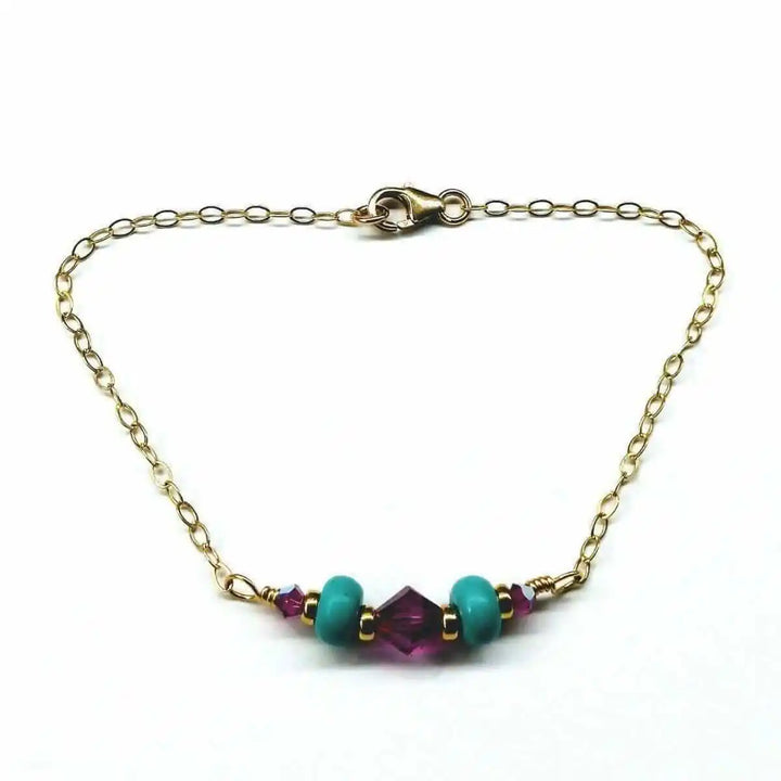 Handmade Gold Filled Pink Turquoise Gemstone Bracelet featuring turquoise beads and fuchsia Swarovski crystals.