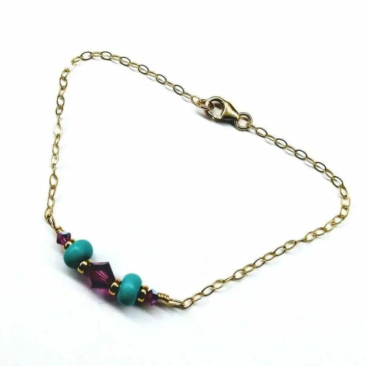 Handmade Gold Filled Pink Turquoise Gemstone Bracelet featuring pink Swarovski crystals and turquoise beads on a gold chain.