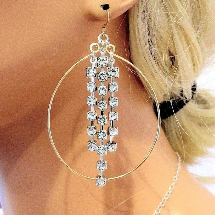 Hammered 14 K Gold Filled Oval Hoop Crystal Chain Earrings featuring sparkling crystals and elegant design.