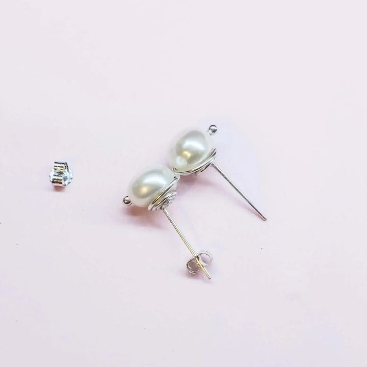 AMD1309Handmade Baroque Freshwater Pearl Silver Spiral StudsJewelryEarrings$ 35.00Alexa Martha Designs