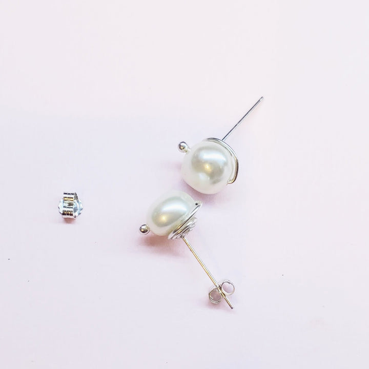 AMD1309Handmade Baroque Freshwater Pearl Silver Spiral StudsJewelryEarrings$ 35.00Alexa Martha Designs