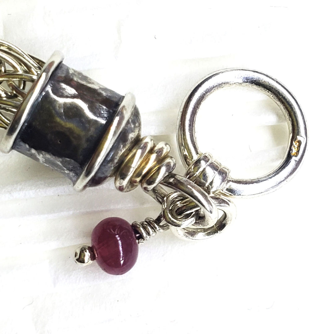 AMD1266Handmade 10mm Silver Viking Knit Bracelet with Ruby CharmJewelryBracelet$ 190.00Alexa Martha Designs