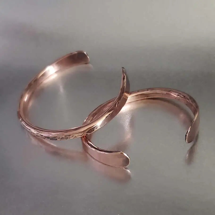 Handmade 2 ounce 6 Gauge Copper Hammered BIGGA Bangle showcasing substantial design and dramatic texture.