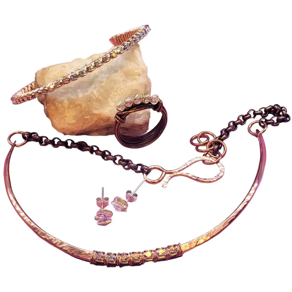 Handmade 7-year anniversary Copper Crystal Choker Set featuring necklace, bracelet, ring, and earrings on display.
