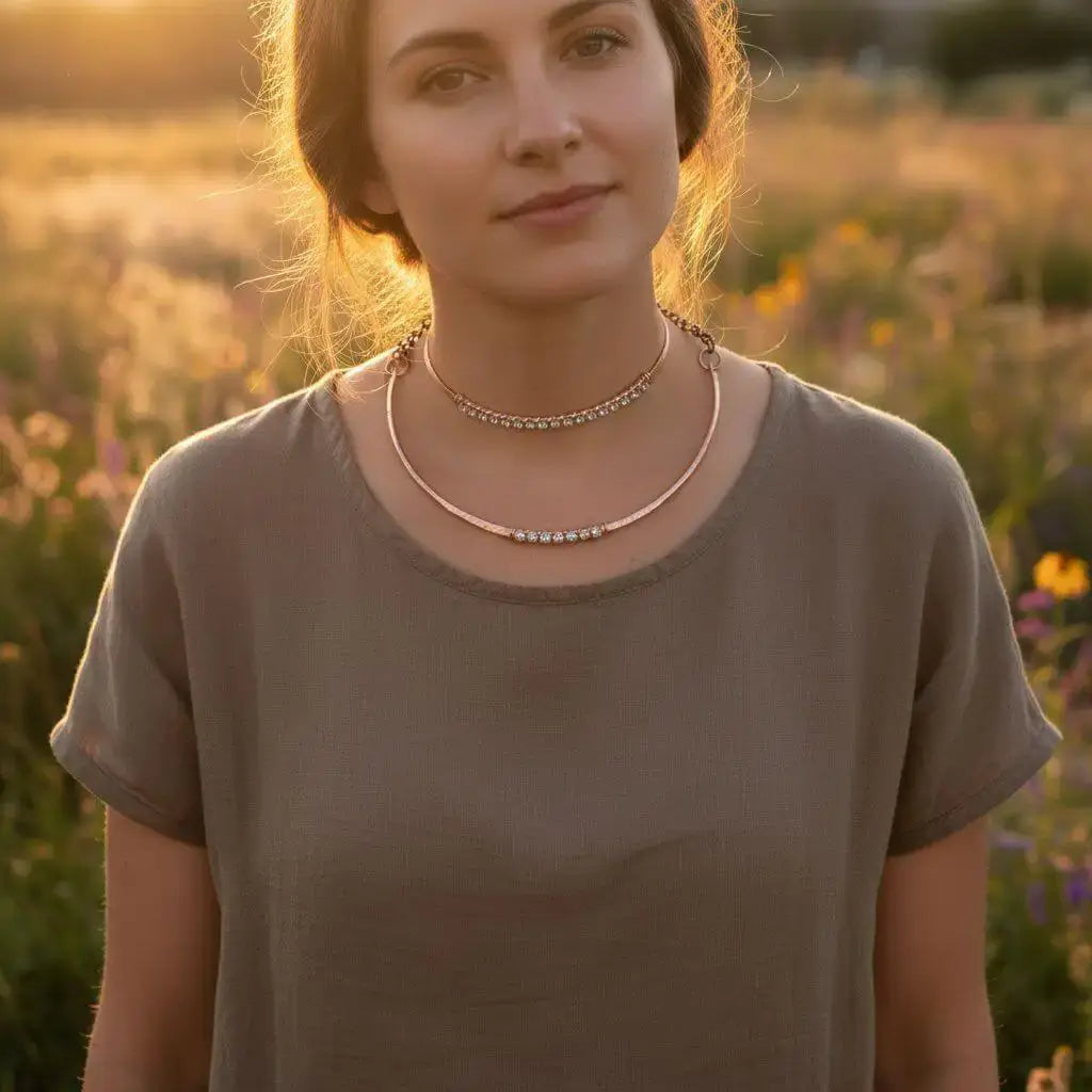 Handmade 7-year anniversary Copper Crystal Choker Set worn by a woman in a field during sunset.