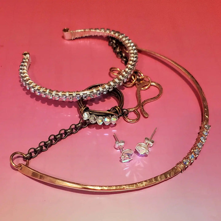 Handmade 7-year anniversary Copper Crystal Choker Set featuring bracelets and earrings on an aesthetic background.