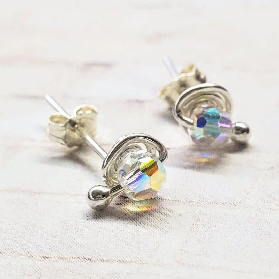 4mm handmade silver crystal spiral ear studs with colorful Swarovski crystals in a minimalist design.
