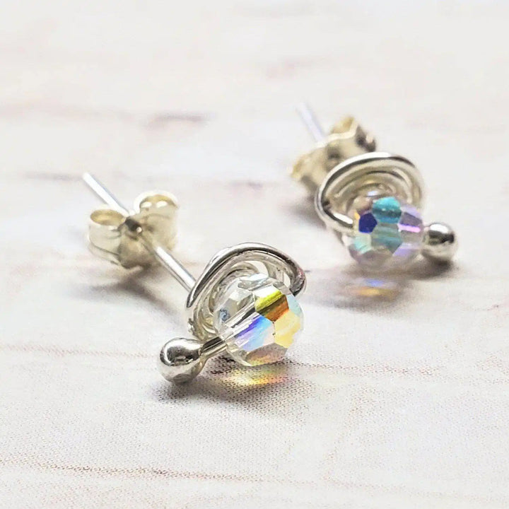 4mm handmade silver crystal spiral ear studs with colorful Swarovski crystals in a minimalist design.