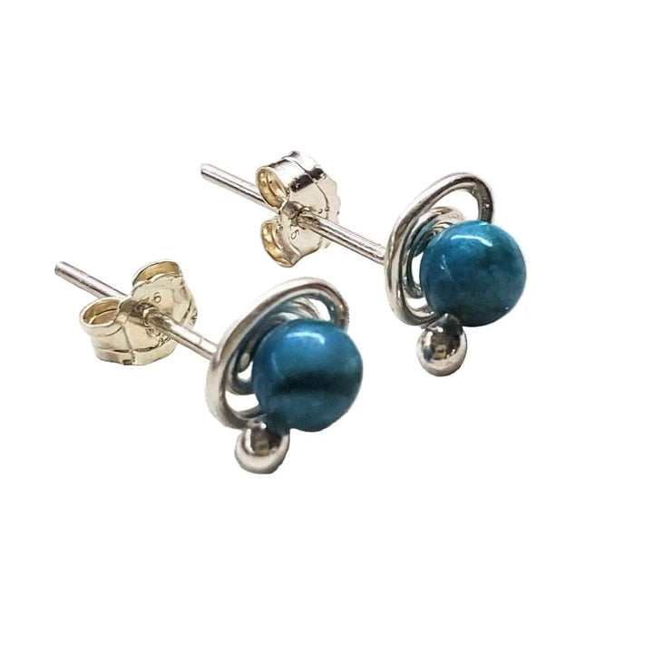 4mm handmade silver crystal spiral ear studs featuring blue gemstones in hand-sculpted sterling silver spirals.