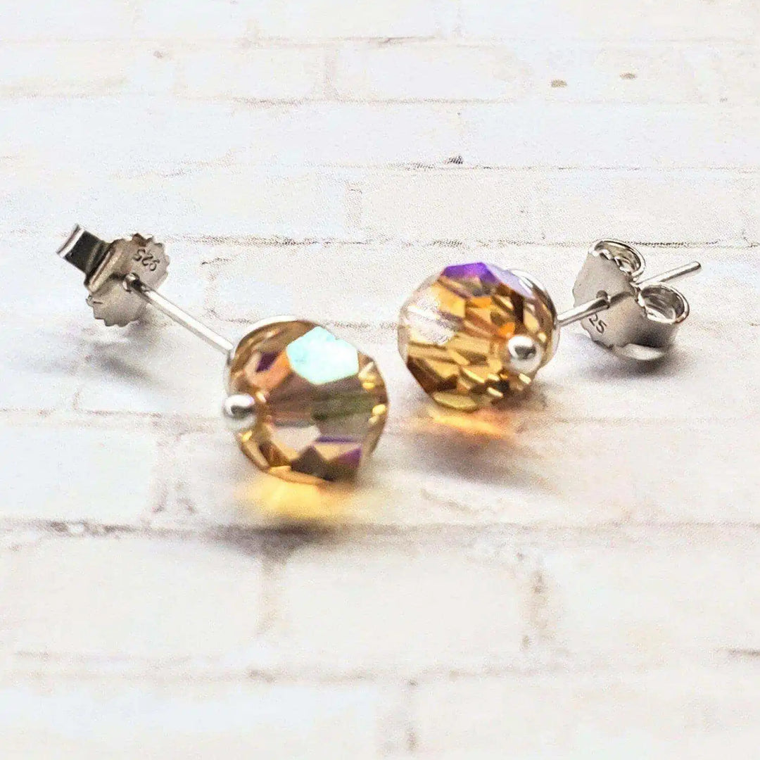 4mm handmade silver crystal spiral ear studs with sparkling Swarovski crystals in a delicate design.