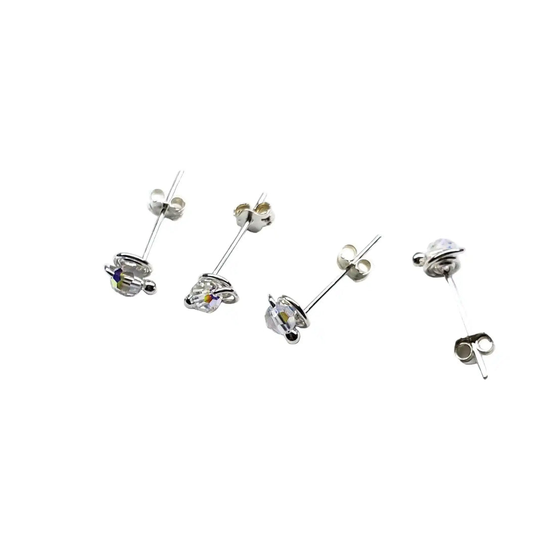 4mm handmade silver crystal spiral ear studs showcasing delicate Swarovski crystals in elegant settings.