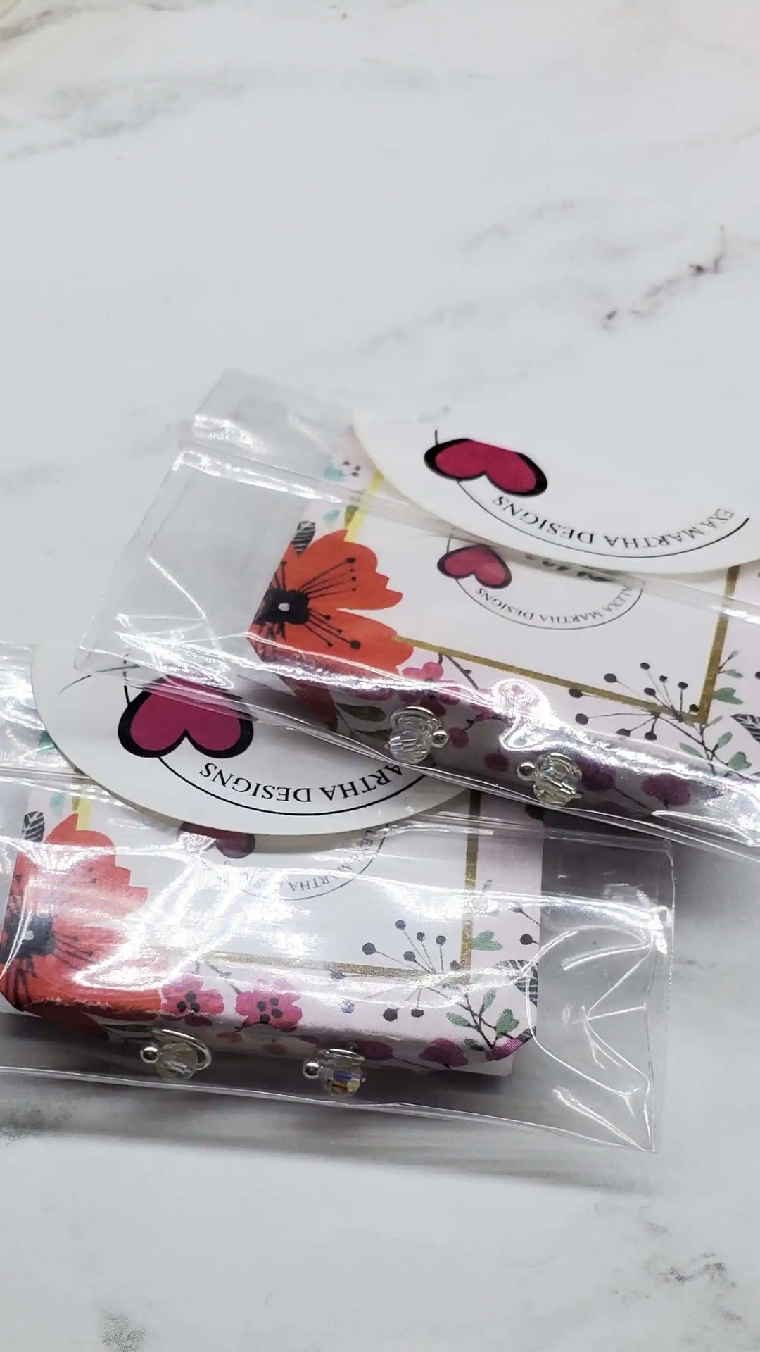 Colorful Floral Packaging by Svatta Designs with Crystal Detail and Brand Logo