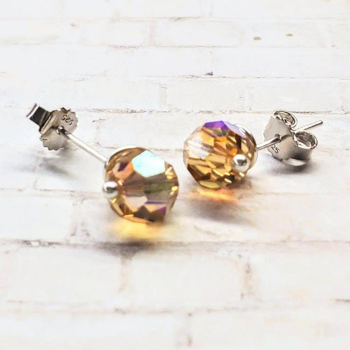 4mm handmade silver crystal spiral ear studs with multicolored crystals, showcasing minimalist elegance and unique design.